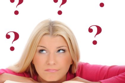Girl and book and question marks